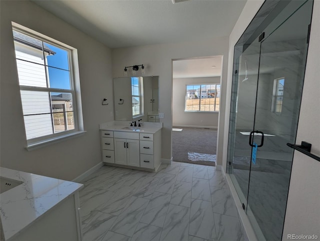 bathroom with vanity and an enclosed shower