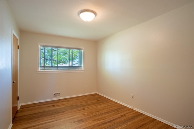 2744 S Newton Way, Denver, CO 80236 - empty room featuring wood finished floors and baseboards