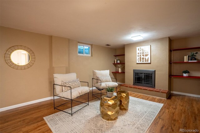 2744 S Newton Way, Denver, CO 80236 - sitting room with wood finished floors, baseboards, and a fireplace
