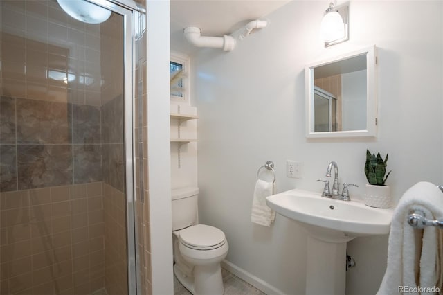 2744 S Newton Way, Denver, CO 80236 - bathroom featuring a shower stall, toilet, and a sink