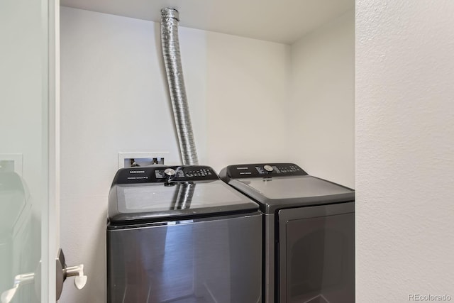 laundry area with separate washer and dryer