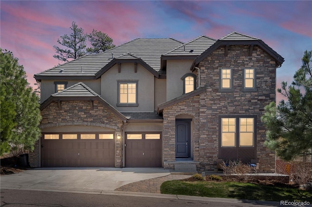6877 Northstar Ct, Castle Rock, CO 80108 - view of front facade featuring stucco siding, stone siding, and driveway