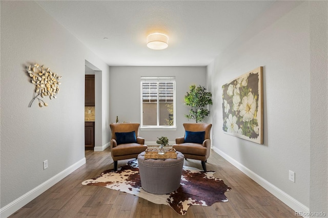 6877 Northstar Ct, Castle Rock, CO 80108 - living area featuring hardwood / wood-style floors and baseboards