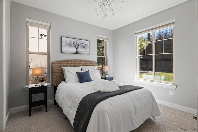 6877 Northstar Ct, Castle Rock, CO 80108 - carpeted bedroom featuring a chandelier and baseboards