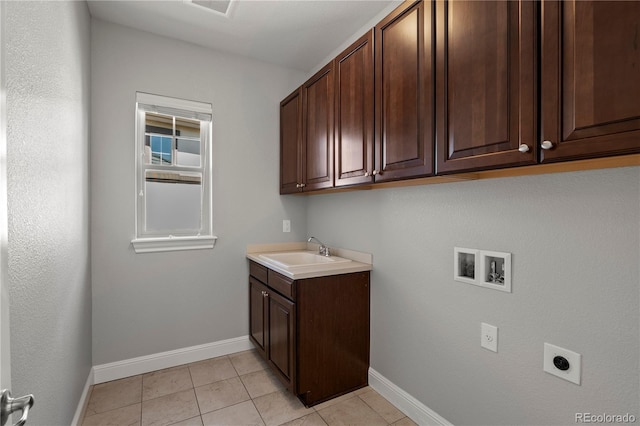 6877 Northstar Ct, Castle Rock, CO 80108 - washroom featuring cabinet space, hookup for an electric dryer, washer hookup, and light tile patterned flooring