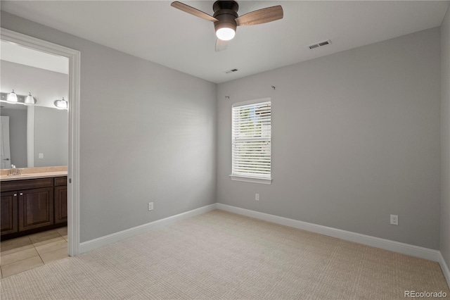 6877 Northstar Ct, Castle Rock, CO 80108 - unfurnished bedroom featuring ensuite bathroom, light colored carpet, and ceiling fan