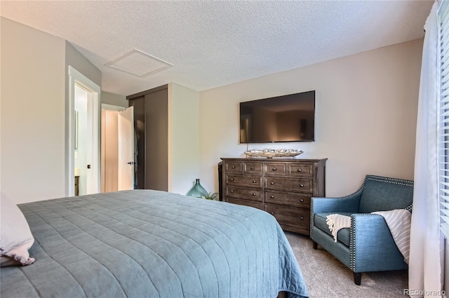 8252 S Fillmore Cir, Centennial, CO 80122 - bedroom featuring attic access, carpet, and a textured ceiling