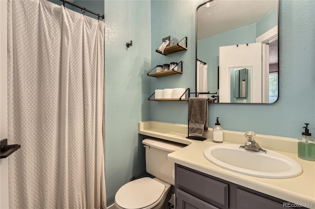 8252 S Fillmore Cir, Centennial, CO 80122 - bathroom with vanity, a textured wall, and a shower with curtain