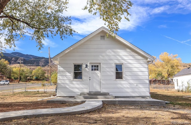 back of property featuring a mountain view