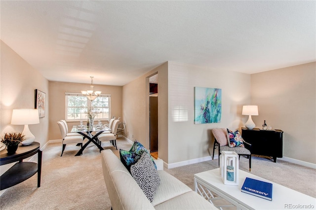 living room with baseboards, a notable chandelier, and light colored carpet