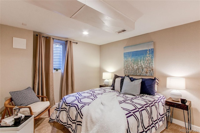 bedroom with baseboards, carpet, and visible vents