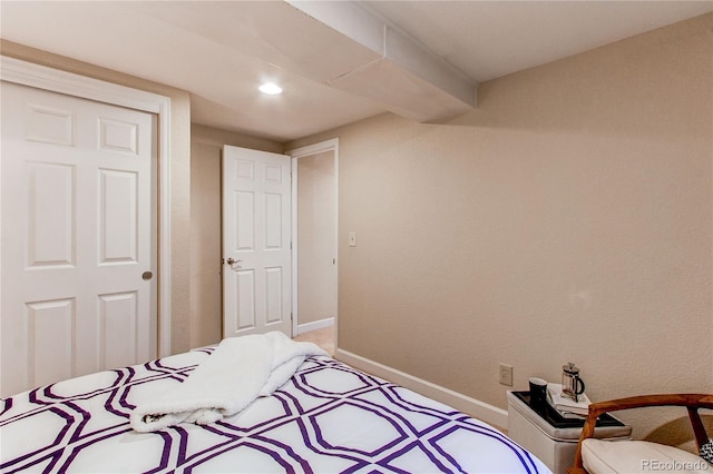 bedroom with recessed lighting, baseboards, and light carpet