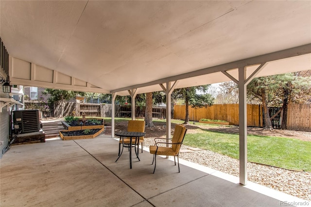 view of patio featuring cooling unit and a fenced backyard