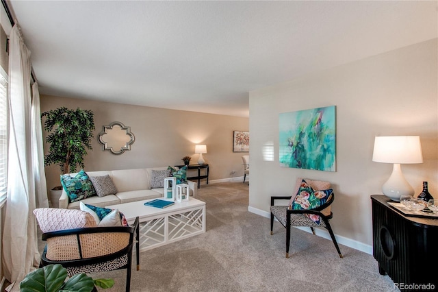 living room with carpet floors and baseboards