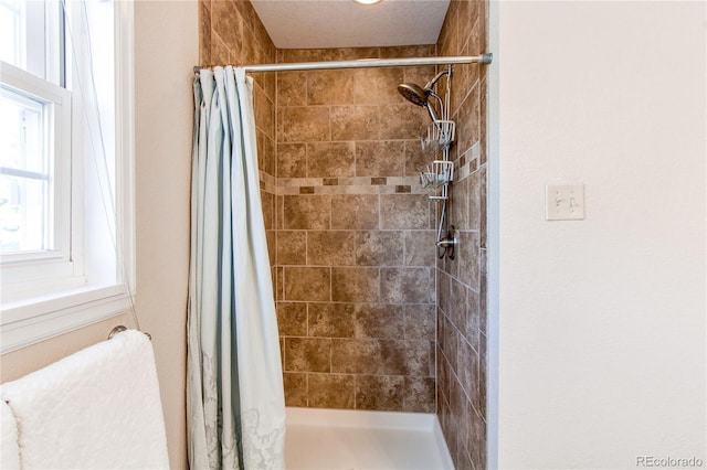 bathroom with a stall shower