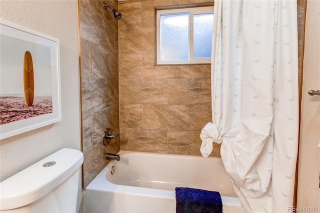 bathroom with toilet and shower / tub combo