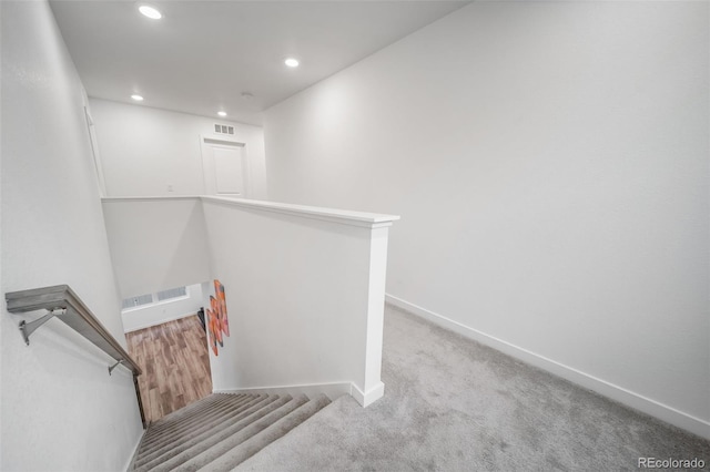 staircase featuring recessed lighting, carpet, visible vents, and baseboards