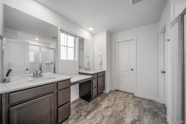 full bathroom featuring a sink, two vanities, a shower stall, and visible vents