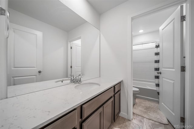 bathroom with shower / bathtub combination with curtain, vanity, and toilet