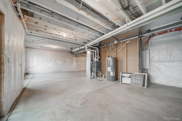 unfinished basement featuring electric water heater