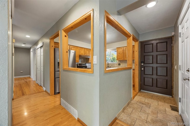 foyer featuring light hardwood / wood-style floors