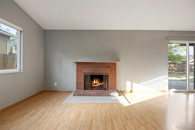 unfurnished living room featuring light hardwood / wood-style flooring and a fireplace