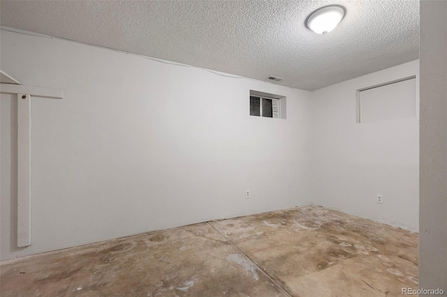 basement with a textured ceiling