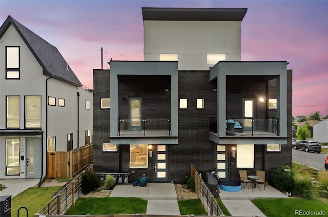 1302 N Stuart St, Denver, CO 80204 - view of front of house with brick siding and stucco siding