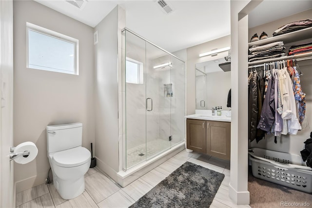 1302 N Stuart St, Denver, CO 80204 - full bathroom with vanity, a stall shower, and a spacious closet