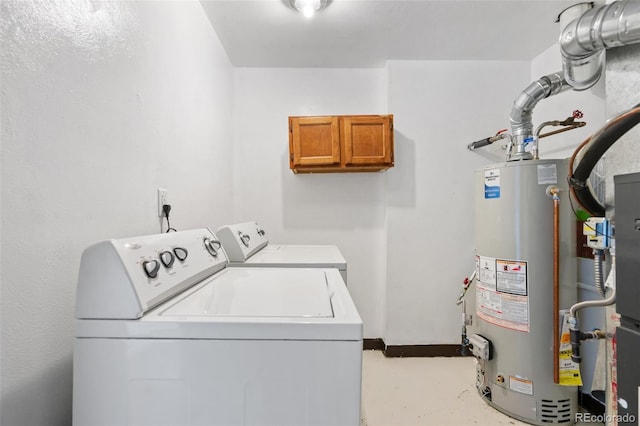 laundry room with washing machine and clothes dryer and gas water heater