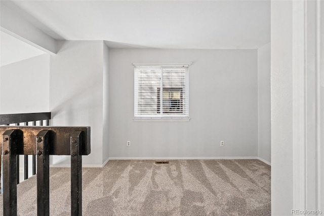 bonus room with baseboards, carpet, and visible vents