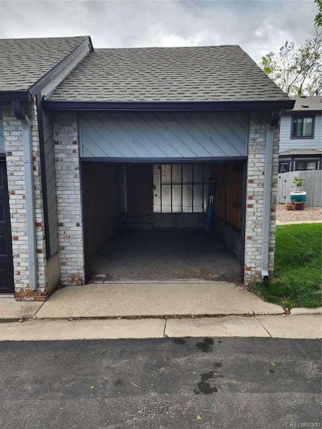 10731 W 63rd Ave Unit A, Arvada, CO 80004 - garage featuring concrete driveway and fence