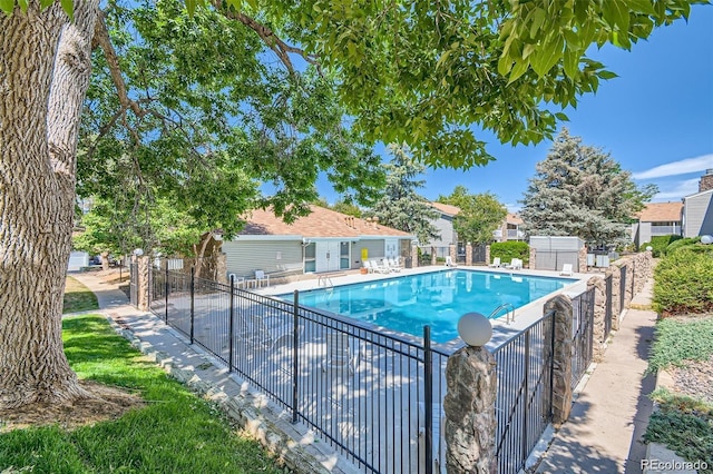 community pool featuring fence
