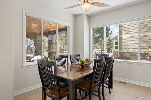 dining space with light tile patterned floors and ceiling fan