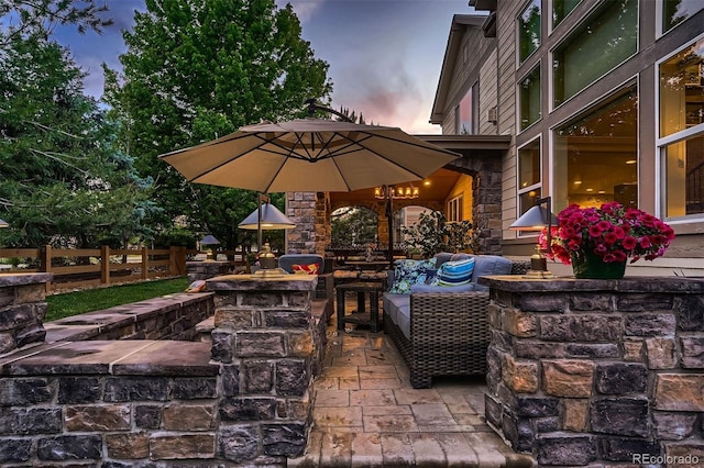 patio terrace at dusk with an outdoor living space