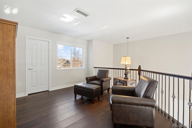 sitting room featuring dark hardwood / wood-style flooring