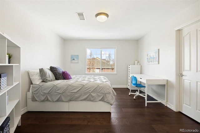 bedroom featuring dark hardwood / wood-style flooring