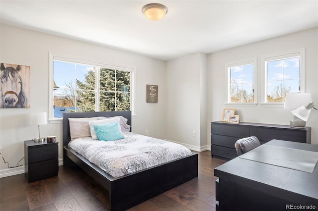 bedroom with dark wood-type flooring