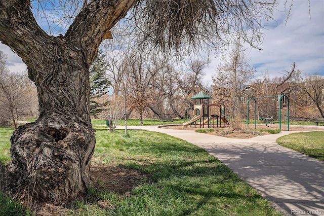 surrounding community featuring a yard and playground community