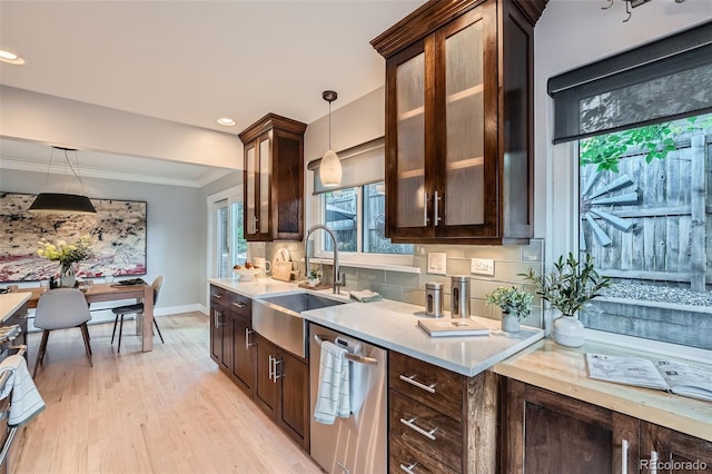 3530 E 8th Ave, Denver, CO 80206 - kitchen with dishwasher, plenty of natural light, dark brown cabinets, ornamental molding, and recessed lighting