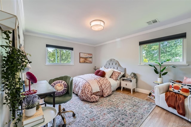 3530 E 8th Ave, Denver, CO 80206 - bedroom with multiple windows, crown molding, and wood finished floors