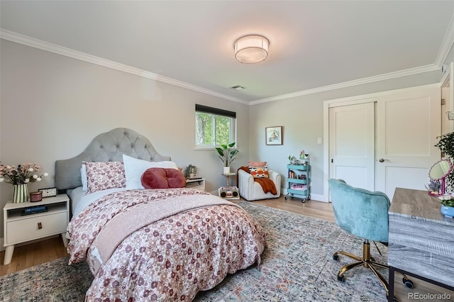 3530 E 8th Ave, Denver, CO 80206 - bedroom with crown molding and wood finished floors