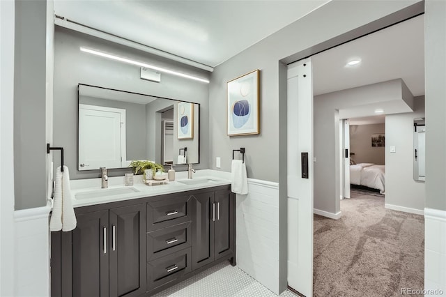3530 E 8th Ave, Denver, CO 80206 - ensuite bathroom featuring double vanity and wainscoting