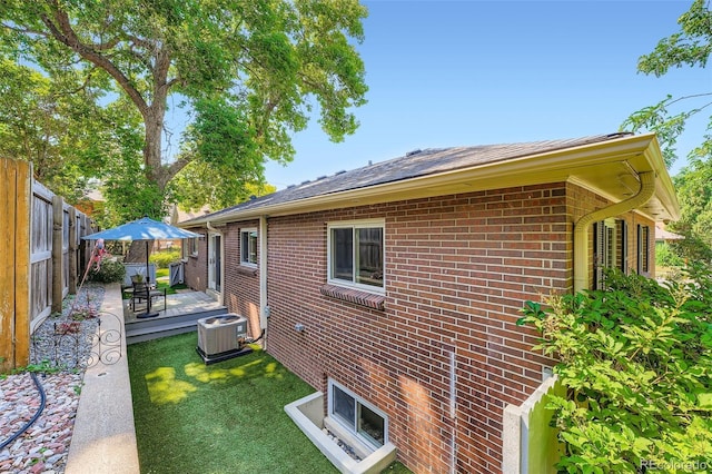 3530 E 8th Ave, Denver, CO 80206 - view of side of home with brick siding and a wooden deck