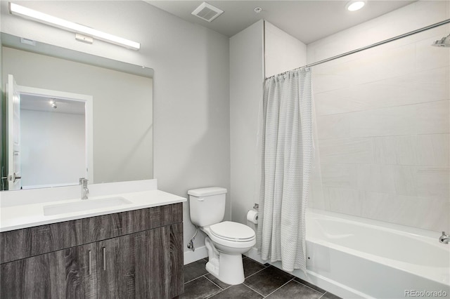 full bathroom featuring vanity, tile patterned floors, toilet, and shower / tub combo