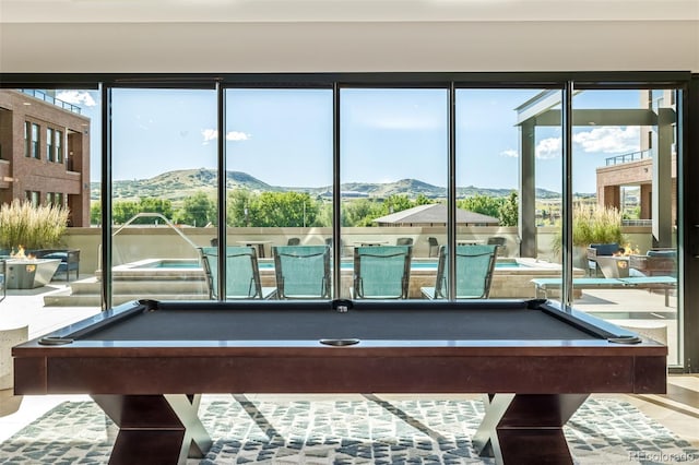 game room featuring a mountain view, tile patterned floors, and pool table