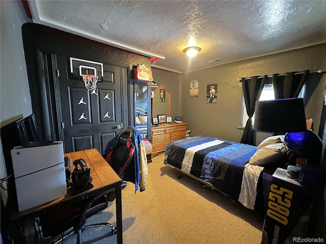 carpeted bedroom with a textured ceiling