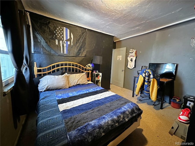 carpeted bedroom with a textured ceiling