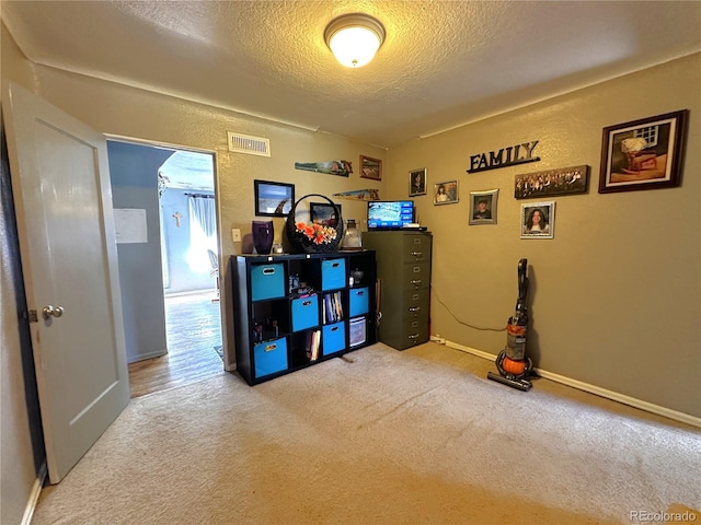 game room featuring carpet floors, baseboards, a textured ceiling, and visible vents