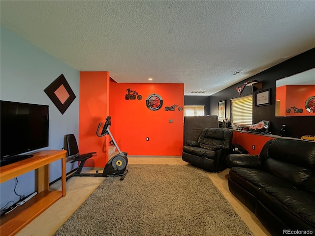 living room with carpet, a textured ceiling, and visible vents